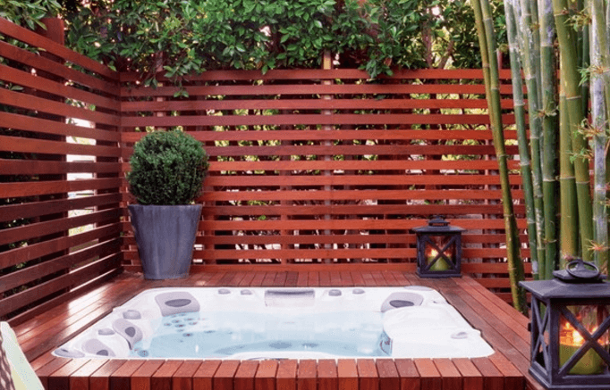 Hot Tub Incorporated into the Deck with Privacy Fence